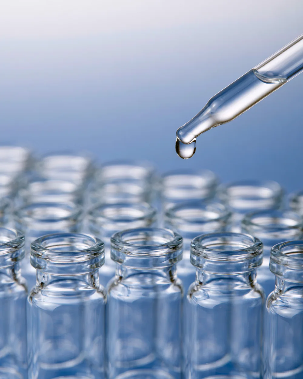 Pharmacist dosing compounded GLP-1 vials in a lab